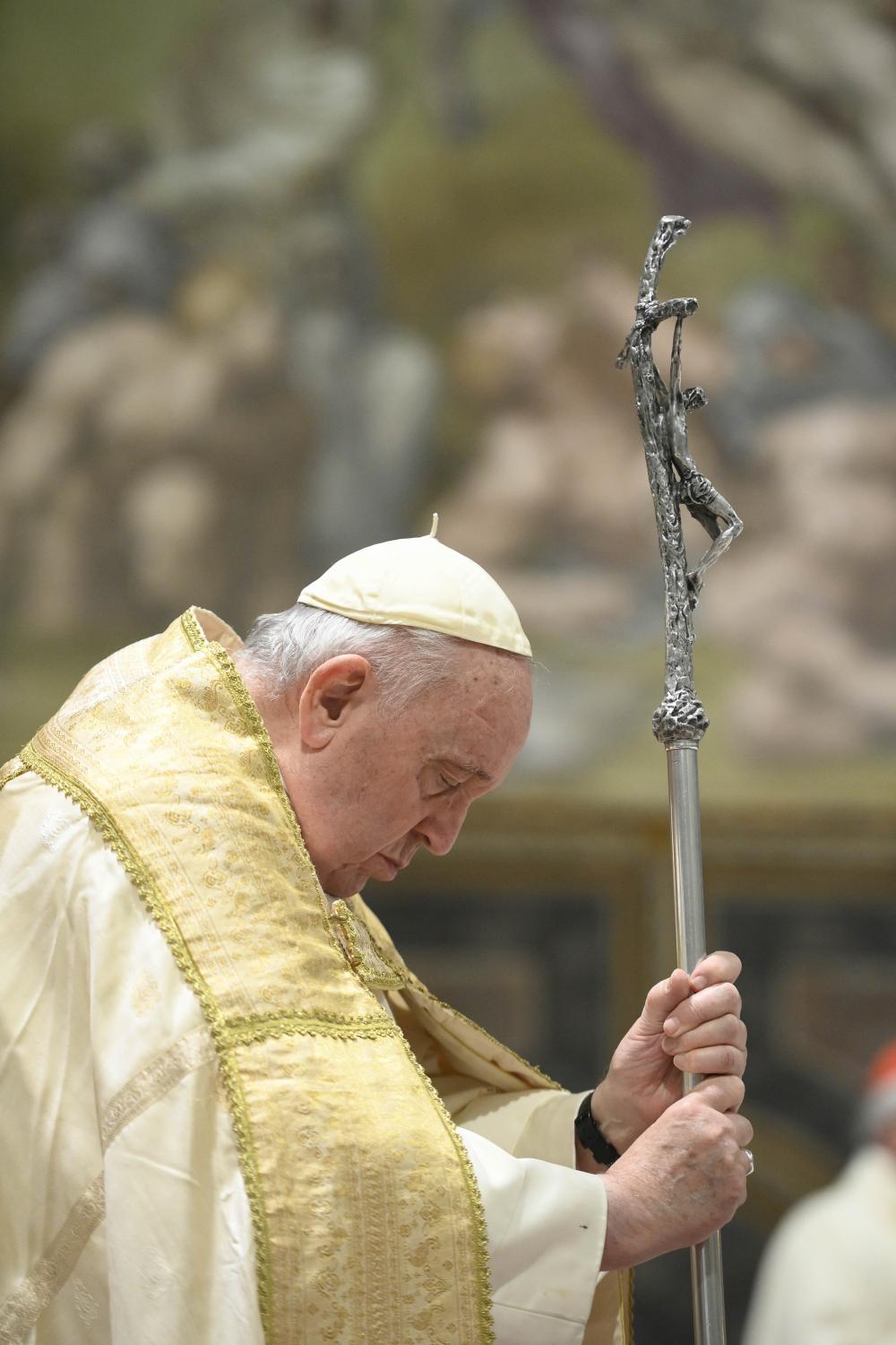 Pope Francis holds his crosier as he celebrates Mass on the feast of the Baptism of the Lord in the Sistine Chapel at the Vatican Jan. 8, 2023. The pope baptized 13 babies at the Mass. (CNS photo/Vatican Media)